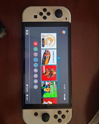 Nintendo switch OLED  con 10 giochi e custodia 