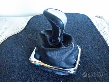 Leva cambio più cornice