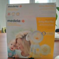 Infanzia tira latte madela
