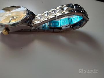 Orologio Binbond tipo Quartz con quadrante dorato