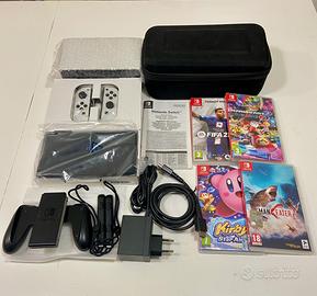 Nintendo Switch OLED + 4 giochi + custodia+vetro