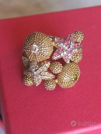 Anello con stelle marine e ricci in argento dorato