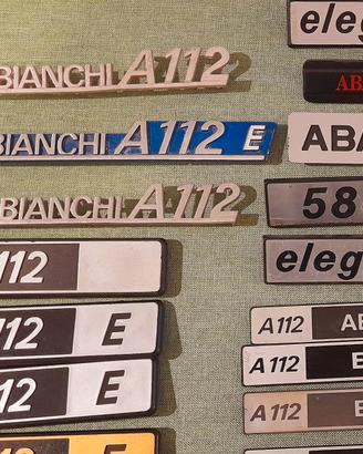 A 112 AUTOBIANCHI SCRITTE , FREGI , STEMMI , LOTTO