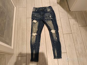 Jeans Denin Skinny con strappi e effetto vernice 