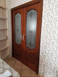 Porta  a  due Ante scorrevole 