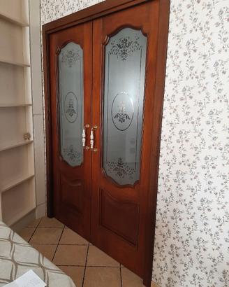Porta  a  due Ante scorrevole 