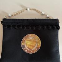 Pochette con tracolla corta