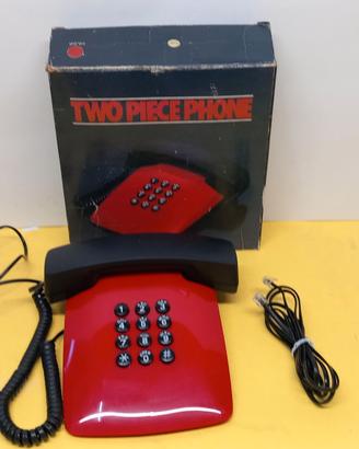 Telefono vintage rosso con cornetta nera, completo