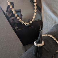 parure di gioielli in acciaio e zirconi 