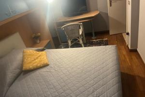 Camera singola con bagno condiviso