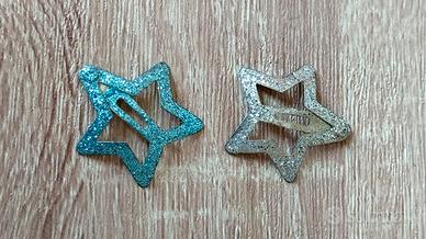 Mollette a forma di stella con brillantini