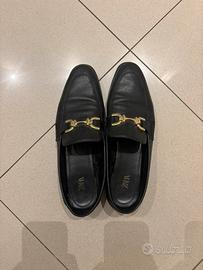 Mocassini in pelle con catena