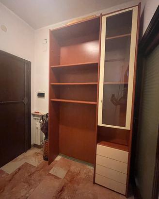 Libreria in legno massello con anta in vetro