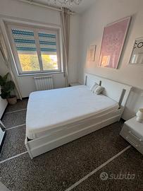 Letto matrimoniale in legno con cassettoni