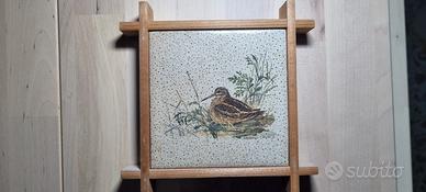 Piastrella decorativa con cornice in legno