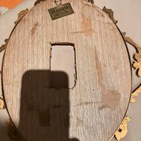 cornice  in  ferro battuto e legno placcata oro