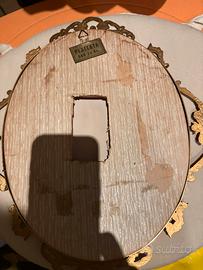 cornice  in  ferro battuto e legno placcata oro