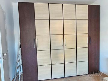 Armadio, letto matriminiale e cucina