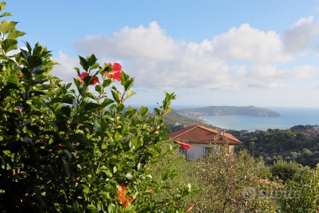 Appartamento con giardino e vista mare