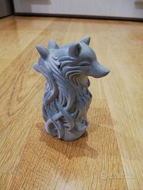 scultura con coppia di lupi