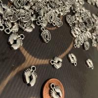 Charm piedini argento tibetano nascita