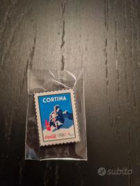 Spilla coca cola milano cortina 2026