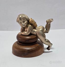 Scultura angelo in metallo con base in legno