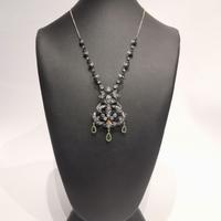 Collana in oro 18KT e argento, smeraldi e rosette