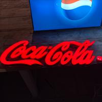 Insegna luminosa Coca-Cola