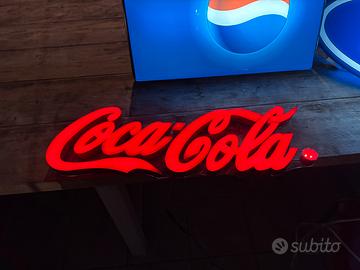 Insegna luminosa Coca-Cola