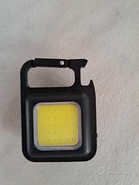 Luce portachiavi cavatappi