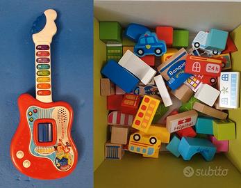 Chitarra elettronica giocattolo e mattoncini legno