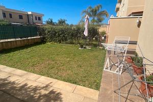 Villetta a schiera, con giardino