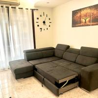 Divano letto con penisola e pouf contenitore