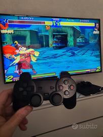 console retro con 2 joystick e tanti giochi sopra 