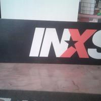 Cartone pubblicitario inxs