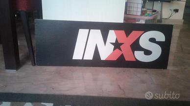 Cartone pubblicitario inxs