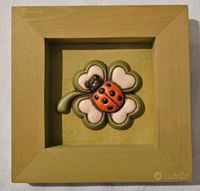 Formella Thun con coccinella e quadrifoglio