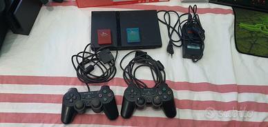 PS2 slim + 2 pad + 2 memory card