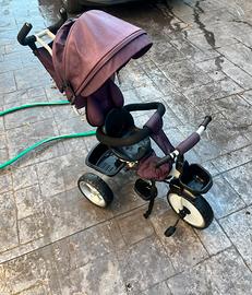 Triciclo per bambini con manico sterzante