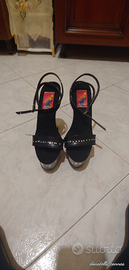 Scarpe alte con zeppa trasparente