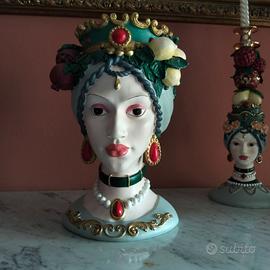 Set due candelabri con testa