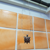 Collana con ciondolo tartaruga