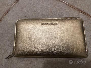 Coccinelle portafoglio con zip in pelle oro