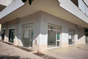 Locale commerciale + magazzino + posto auto