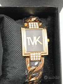 OROLOGIO COLORE ORO FONDO NERO TVK