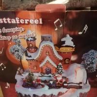 Giostra per villaggio di natale con casetta