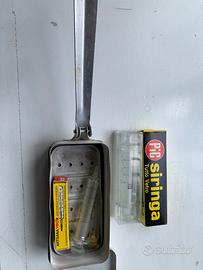 Siringhe in vetro con bollitore