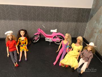 5 barbie originali e una bicicletta