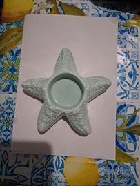porta candele a forma di stella